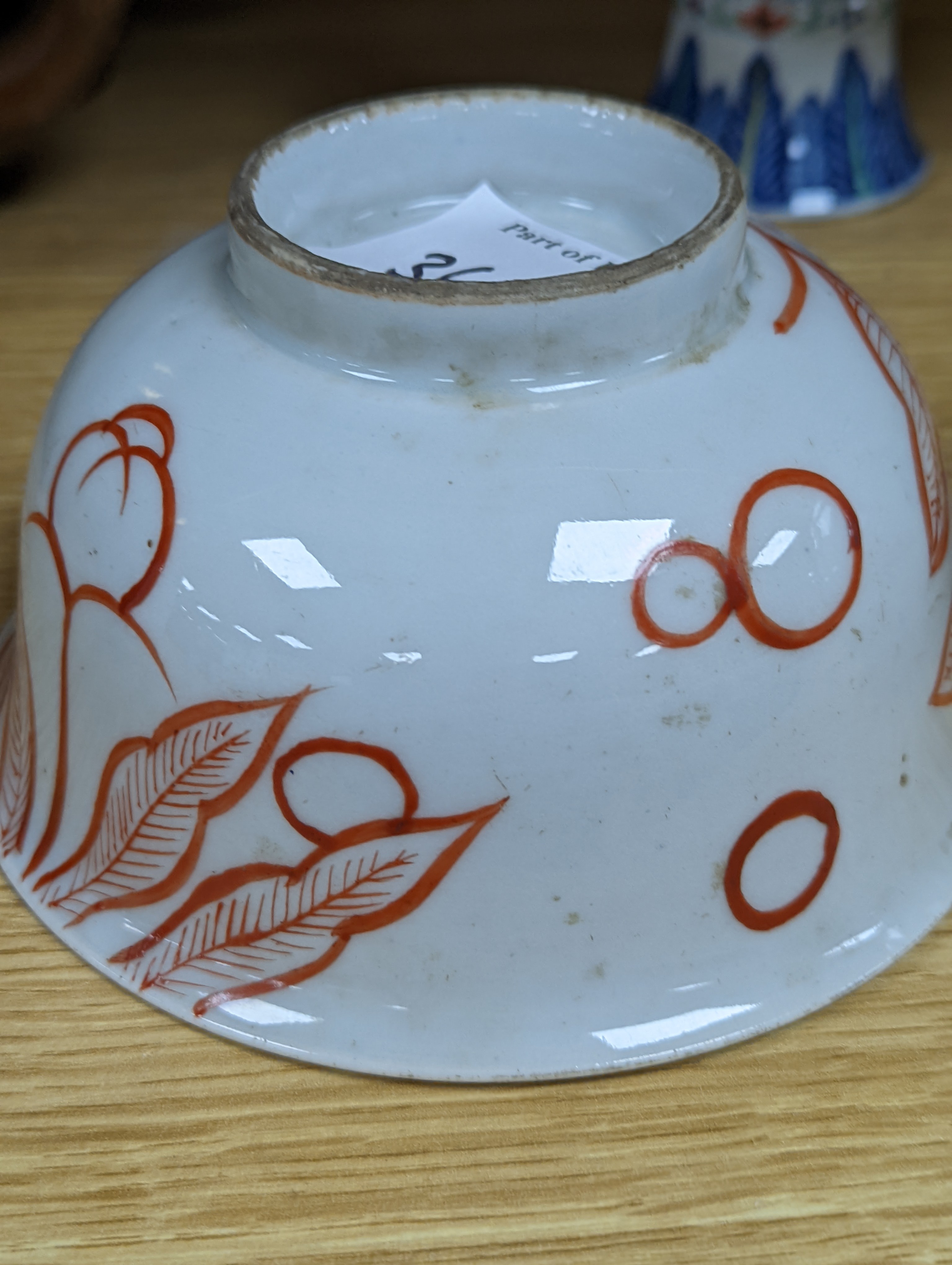 A Chinese blue and white water pipe vessel, a doucai stem dish and a Japanese Imari bowl, 19th century, (3)